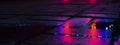 Background of wet asphalt with neon light. Blurred background, night lights of a big city, reflection, puddles. Royalty Free Stock Photo