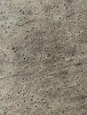 Background of wet sand with pores. Beach sand seamless pattern.