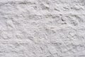 Background of white cracked plaster on the wall Royalty Free Stock Photo