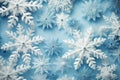 background white homemade paper snowflakes on a blue background
