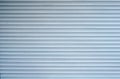 Background of white metal horizontal blinds.