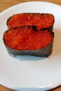 Background white plate of sushi food with the name tobiko gunkan