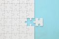 background of white puzzle with missing piece. Royalty Free Stock Photo