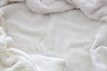 Background of white shaggy blanket texture.