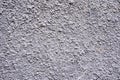 Background of a white stucco coated and painted exterior, rough cast of cement and concrete wall texture Royalty Free Stock Photo