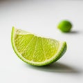 Background a whole lime is blurred emphasizing the wedge in the Royalty Free Stock Photo