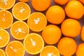 The background of whole and sliced oranges Royalty Free Stock Photo