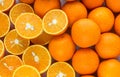 The background of whole and sliced oranges Royalty Free Stock Photo