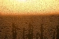 Background window glass with raindrop and red sunset, texture rain Royalty Free Stock Photo