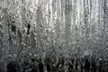 Background. Winter. Frozen icicles against the background of falling water Royalty Free Stock Photo