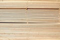 Background from wooden boards close-up. Stacked stacks of wooden planks