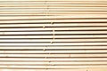 Background from wooden boards close-up. Stacked stacks of wooden planks