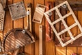 A background with wooden and metal tools hanging on the wooden wall.