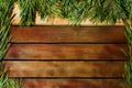 Background of wooden planks and branches of pine