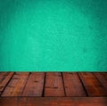 Background with wooden table and grunge cyan wall