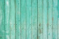 Background from wooden vertical planks, painted in a beautiful light green color, a little shabby, nailed with old rusted nails Royalty Free Stock Photo