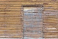 Background of wooden wall with boarded up window Royalty Free Stock Photo