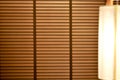 Background of wooden window blinds, sunshine and shadow on window blind Royalty Free Stock Photo