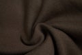 Background of woolen knitted brown sweater top view, cloth sample concept