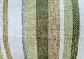 Background of woven fabric texture with striped patterns in various shades of white, green, blue, and brown Royalty Free Stock Photo