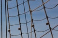 Background wrapped and sealed shroud from an old tallship, rope and chain against a beautiful blue sky Royalty Free Stock Photo