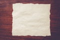 White sheet of paper on a wooden background Royalty Free Stock Photo