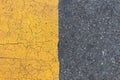 Background of yellow black strips . Dark grey asphalt road divided by yellow pain Royalty Free Stock Photo