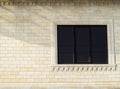 Background of yellow brick and windows. Wall of yellow bricks with a plastic window. The texture of the wall Royalty Free Stock Photo