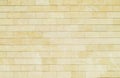 Background of yellow bricks. Wall of yellow bricks. The texture Royalty Free Stock Photo