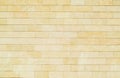 Background of yellow bricks. Wall of yellow bricks. The texture of the wall. Royalty Free Stock Photo