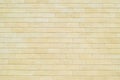 Background of yellow bricks. Wall of yellow bricks. The texture of the wall. Royalty Free Stock Photo