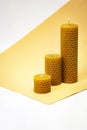 Background with yellow candles with beeswax