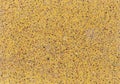 Background of a yellow concrete slab with colored gravel.