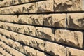 Background of yellow facing bricks. Side view close up. Royalty Free Stock Photo