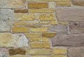 Background of yellow and pink stones. Old wall.