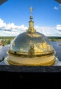 Golden cross on the main dome of the Epiphany Cathedral, Nilov Monastery, Tver region. Royalty Free Stock Photo