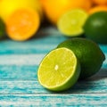 Backgrounds. Close up shot of fresh limes. Focus on the central part of sliced lime. Square Royalty Free Stock Photo