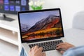 Backgrounds MacOS High Sierra in the screen of MacBook Pro Royalty Free Stock Photo