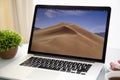 Backgrounds MacOS Mojave in the screen of MacBook Pro