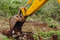 Backhoe Bucket Digging At Road Construction Site