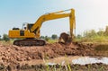 backhoe Dig the soil to make a pond Royalty Free Stock Photo