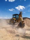 Backhoe Digging at Construction Site