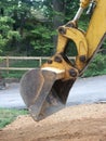 Backhoe digging dirt Royalty Free Stock Photo