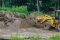 Backhoe digging the ground during works at for soil construction Royalty Free Stock Photo