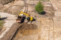 Backhoe and dump truck working on construction site. aerial photo Royalty Free Stock Photo