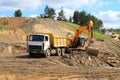 Backhoe loader loading dumper