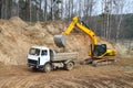 Backhoe loader loading dumper