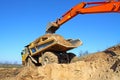 Backhoe loader loading dumper