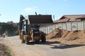 Backhoe loader moving soil in Durban