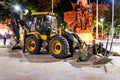 Backhoe Loader On Public Park Construction At Night In Turkey